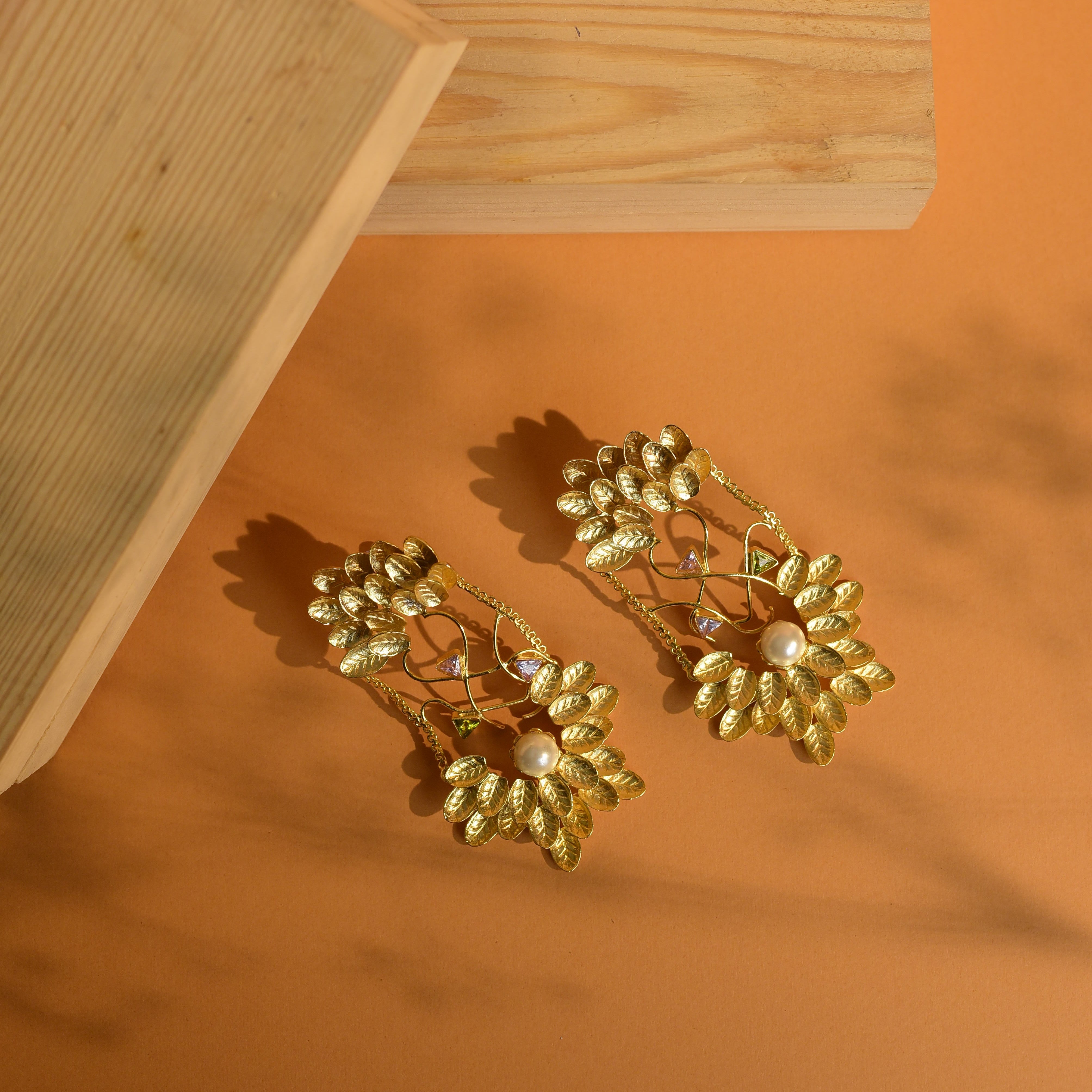Dazzling gold earrings with pearl