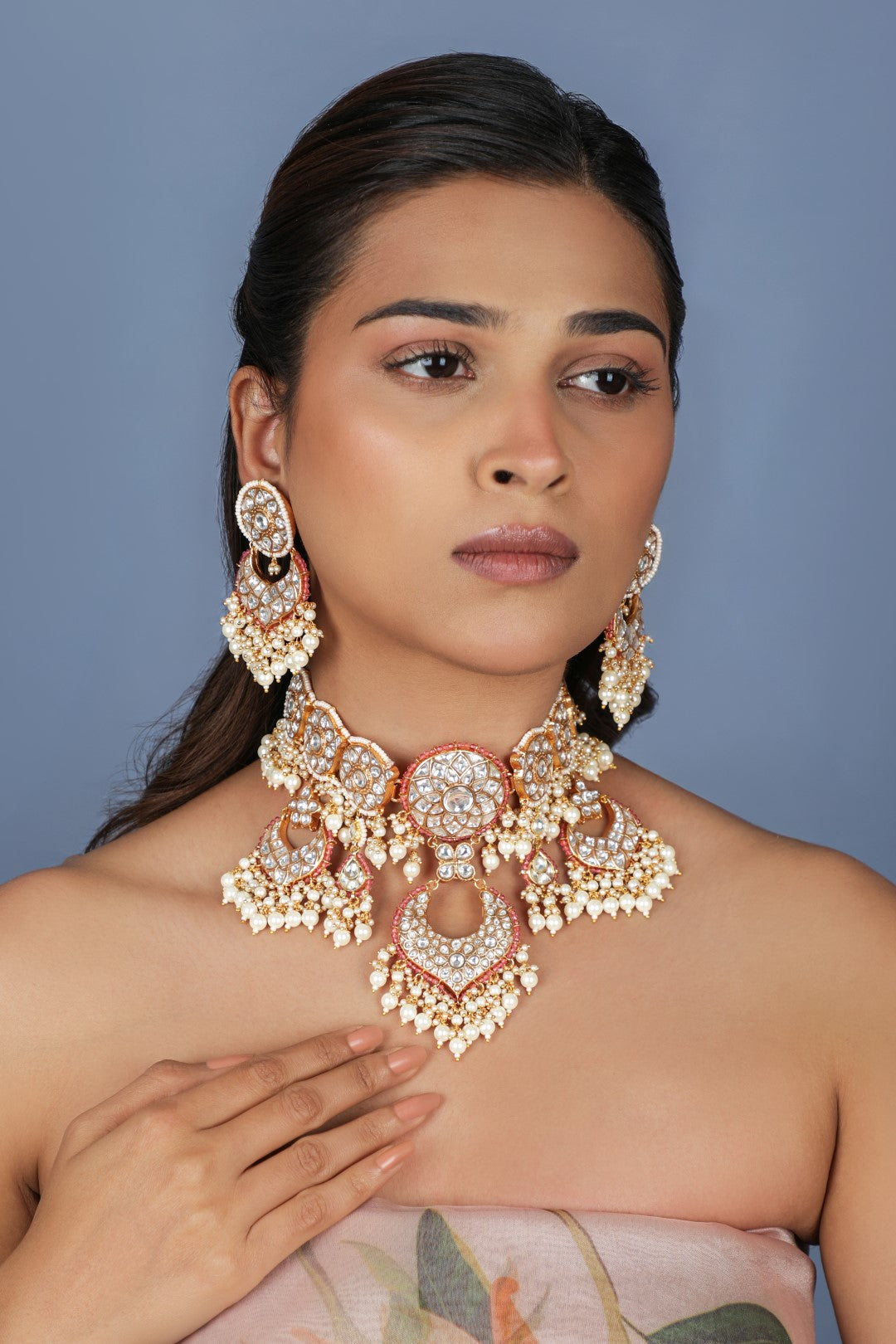 Handcrafted choker necklace with a little touch of pink.