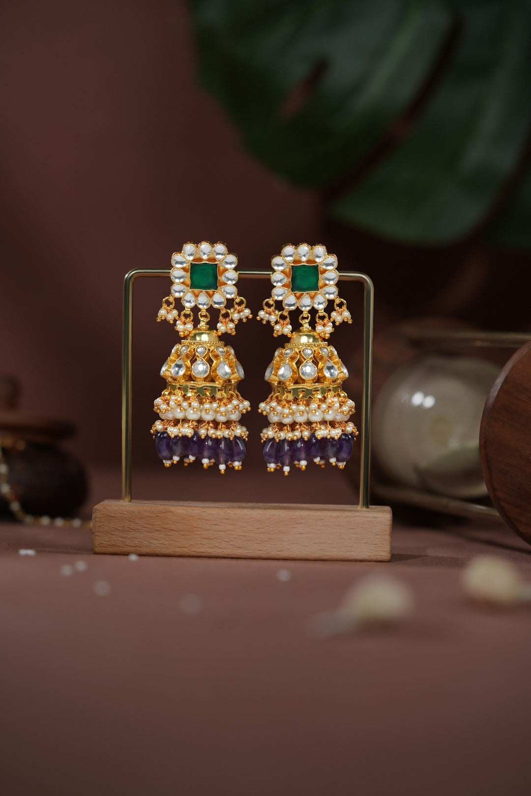 Purple beaded with emerald green stone jhumka