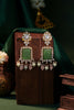 Handcrafted earings with carved stone