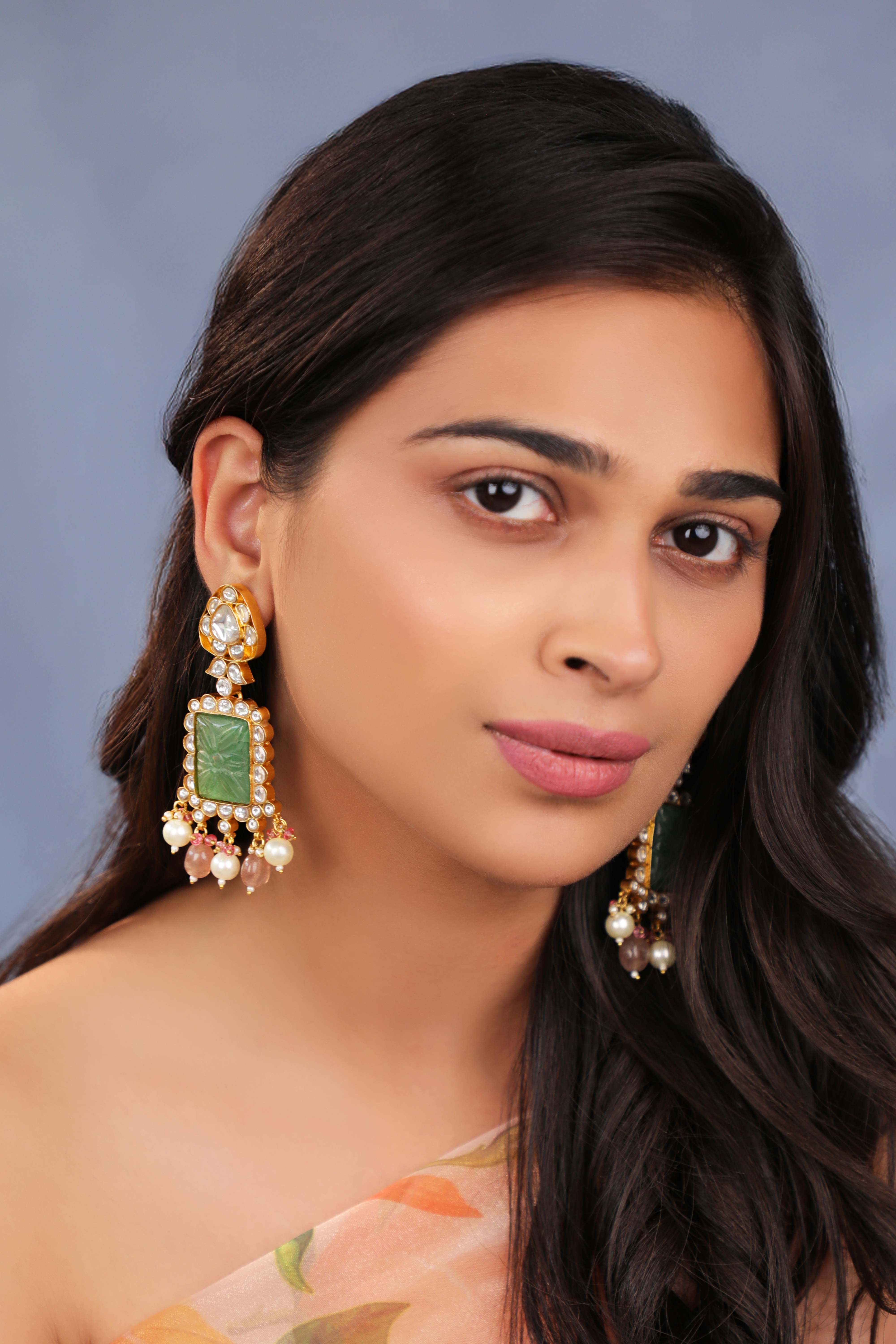 Handcrafted earings with carved stone
