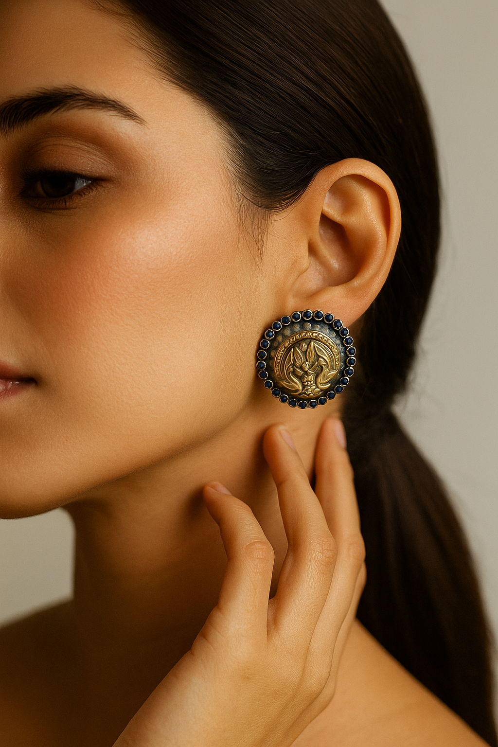 Coin Motif Stud Earrings with Blue Stone Border